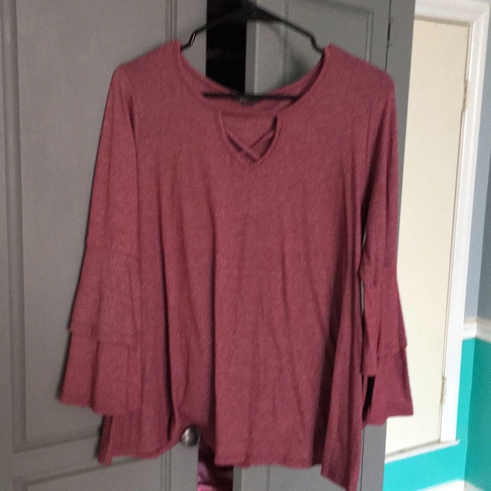 speckled maroon blouse.